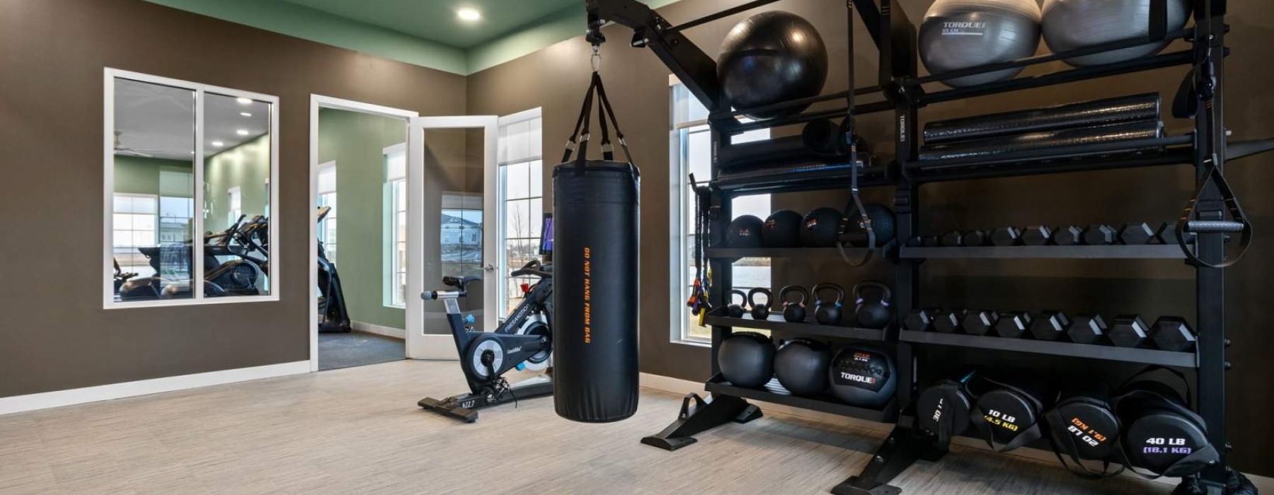 community fitness center with free weights, boxing, and cardio