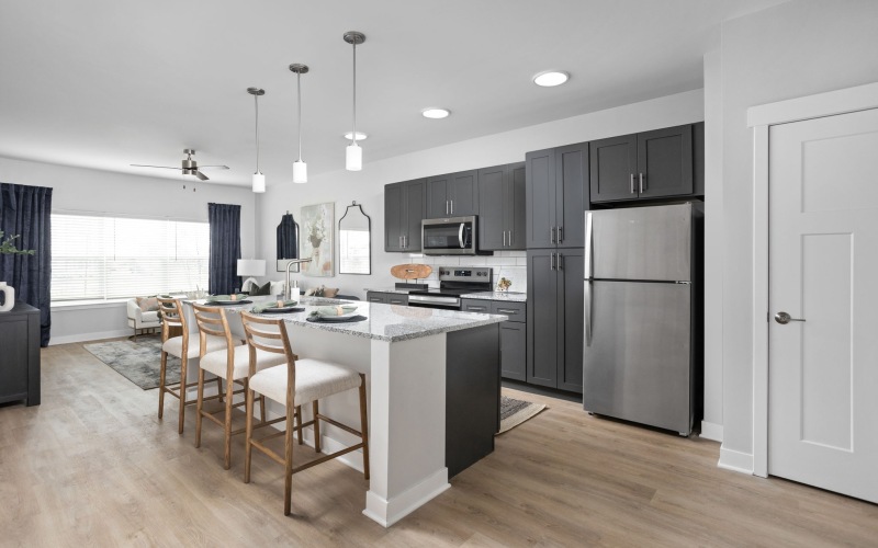 a kitchen with a table and chairs